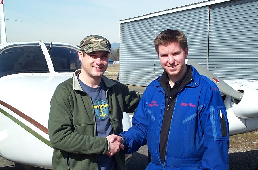 Alex Tremblay with Flight Instructor Phil Craig after the successful completion of Alex's Group 1 Instrument Rating Flight Test on March 12, 2009.  Langley Flying School.