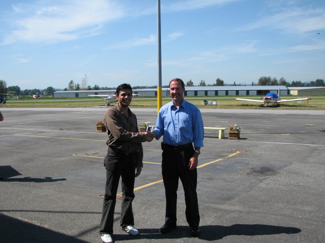 Ali Rumani with Jeff Durand after successfully completing his Private Pilot Flight Test on August 15, 2007.  Langley Flying School