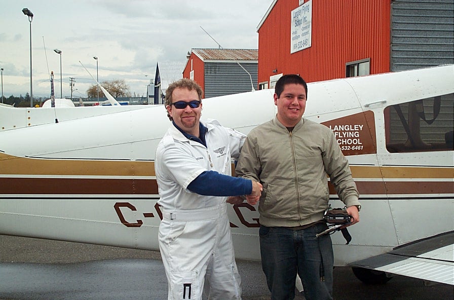 Carlos Calderon Gutierrez with Flight Instructor David Page after Carlos' First Solo Flight on January 15, 2008.  Langley Flying School.