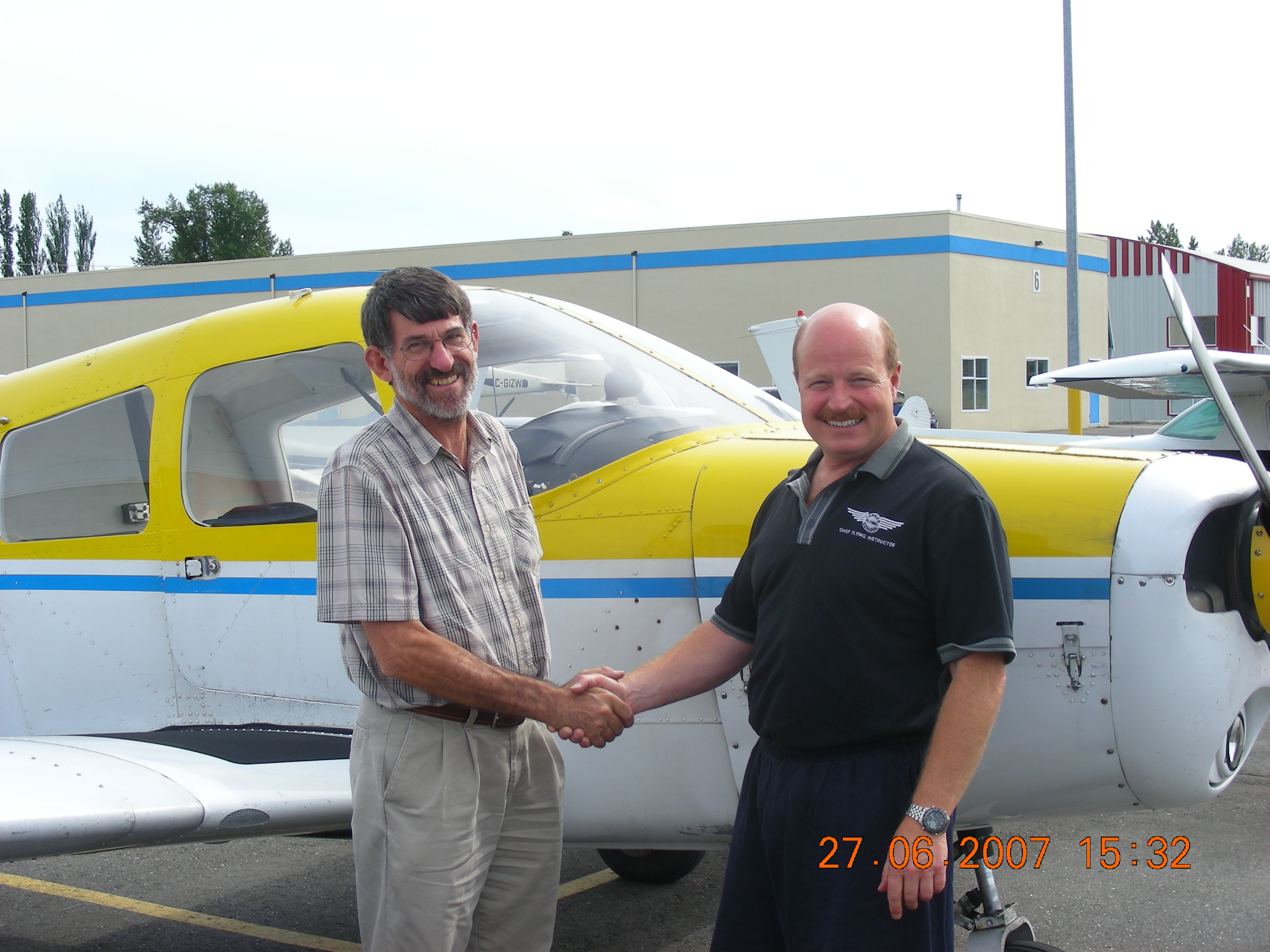 Ed Boon with Chief Flight Instructor David Parry after successfully completing his Private Pilot Flight Test on June 27, 2007 in Cherokee GODP.  Langley Flying School