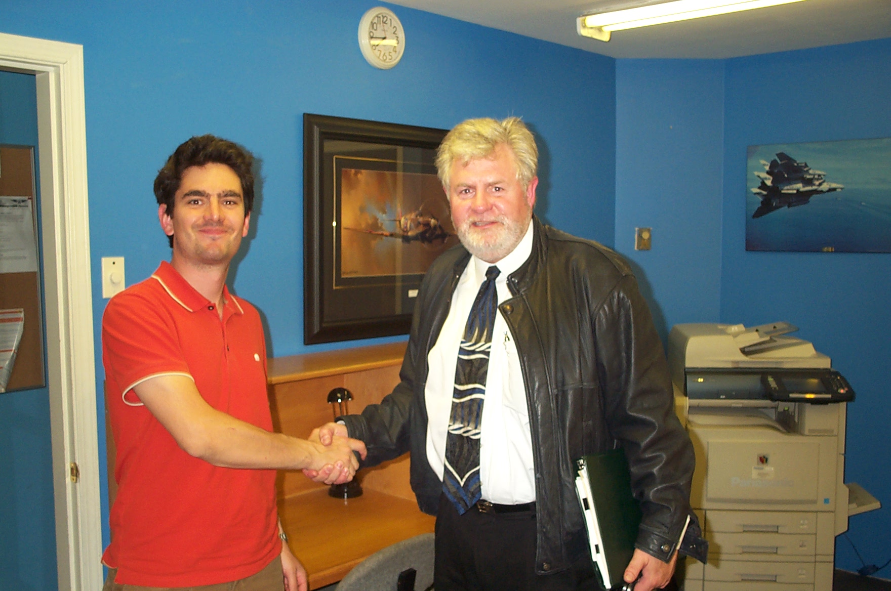 Jonathan King receives congratulations from Pilot Examiner Paul Harris following the successful completion of Jonathan's Commercial Pilot Flight Test on September 11, 2010. Congratulations also to Jonathan's Flight Instructor, Beda Grunder. Langley Flying School.
