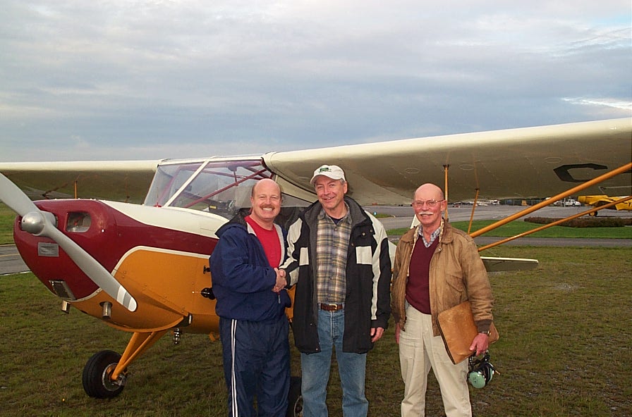 Lloyd Blackburn (centre) with Flight Instructor David Parry and Pilot Examiner Donn Richardson after the successful completion of Lloyd's Private Pilot Flight Test.  Langley Flying School.