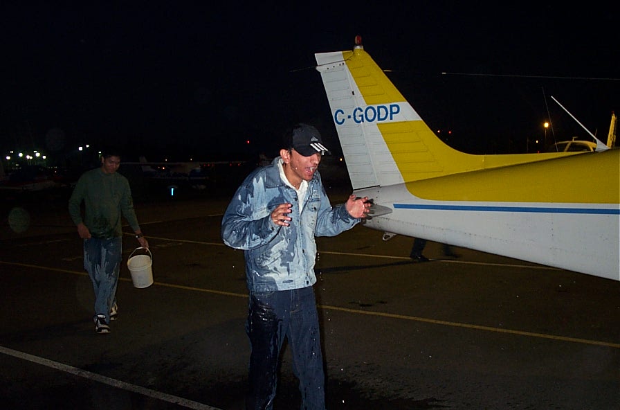 Mayank Mittal gets a soaking after completing his First Solo Flight on October 26, 2007. Langley Flying School.