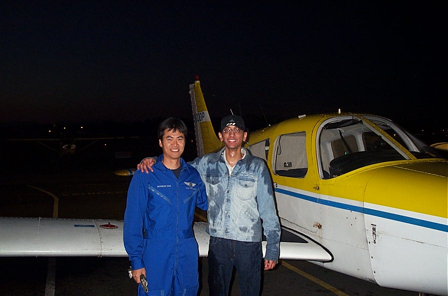 Mayank Mittal (after being soaked by fellow student pilots) with Flight Instructor Hoowan Nam after the completion of Mayank's First Solo Flight on October 26, 2007.  Langley Flying School.