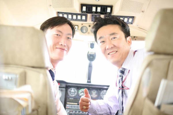 Seung-ha Lee (left), Langley Flying School Graduate now employed with Korean Airlines.
