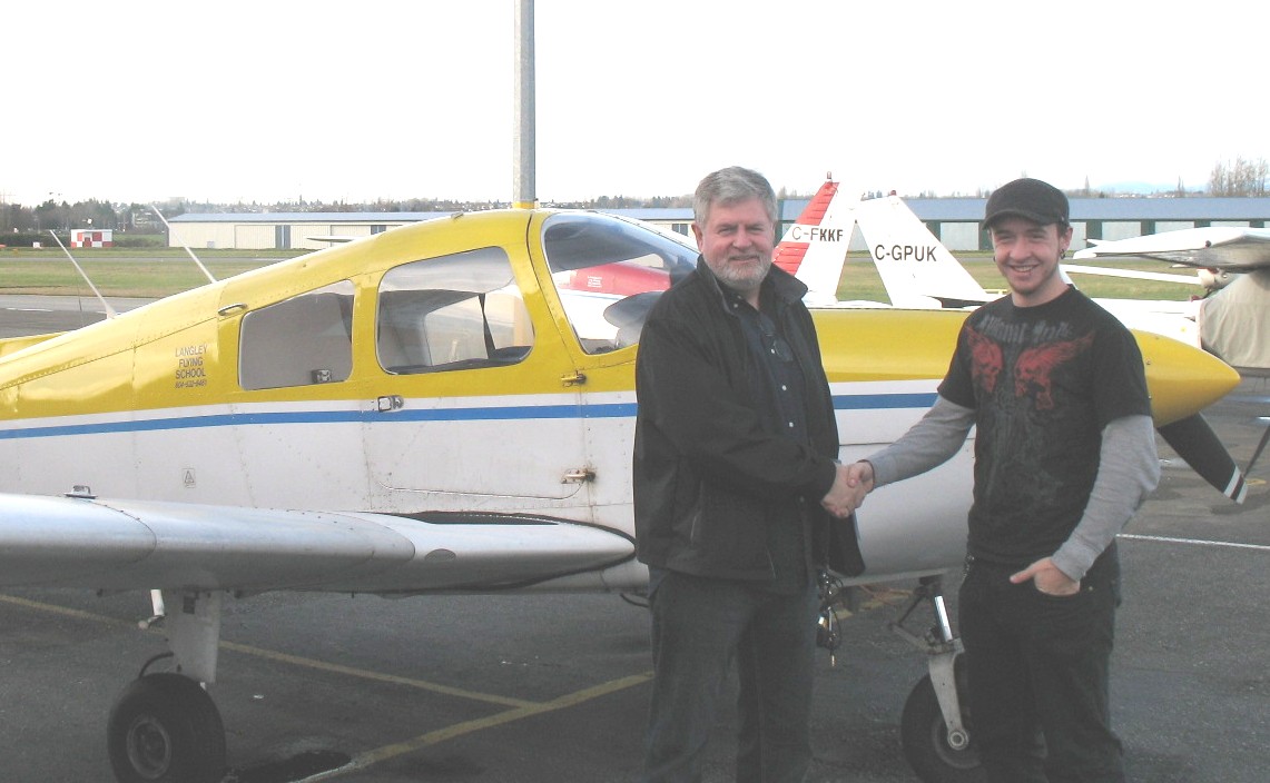 Steve Dirks with Pilot Examiner Paul Harris after the successful completion of Steve's Private Pilot Flight Test.  November 23, 2008.  Langley Flying School.