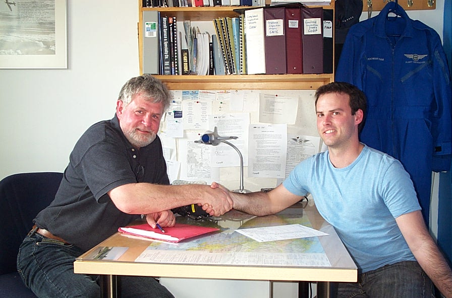 Zenon Garnett receives congratulations from Pilot Examiner Paul Harris after the successful completion of Zenon's Private Pilot Flight Test on April 27, 2009.  Langley Flying School.