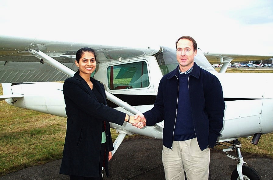 Sukhmani Brar receives congratulations form Pilot Examiner Jeff Durrand after the successful completion of Sukhmani's Commercial Pilot Flight Test on December 21, 2008 in Cessna GPUK.  Langley Flying School.