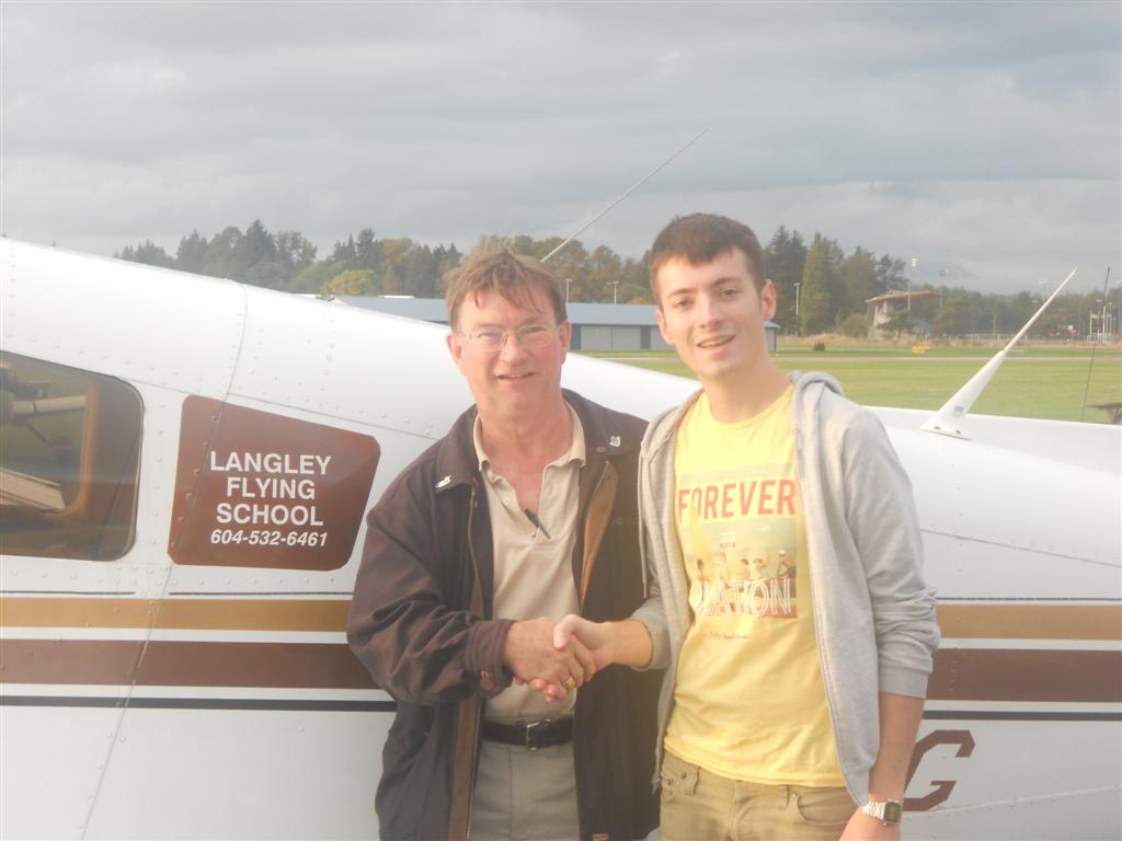 Florian James with Pilot Examiner John Laing after the successful completion of his Commercial Pilot Flight Test on October 12, 2011. Langley Flying School.